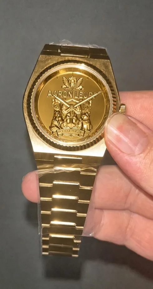 Full custom gold watch with engraved crest dial