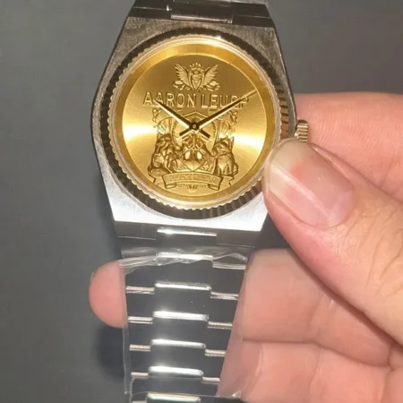 Custom gold and silver plated watch with engraved crest dial