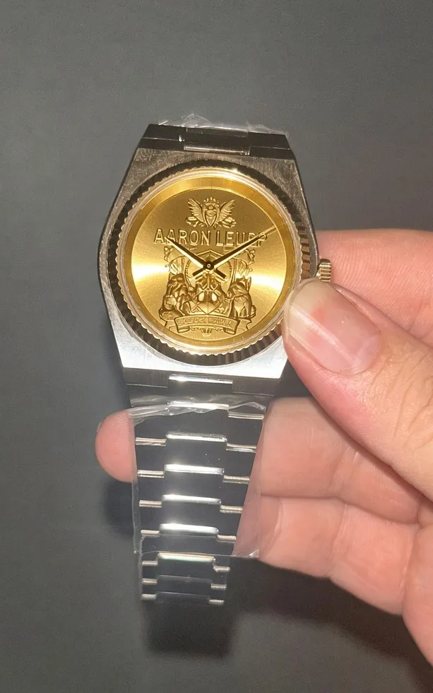 Custom gold and silver plated watch with engraved crest dial